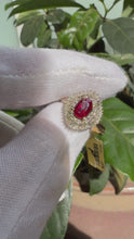 Load and play video in Gallery viewer, Regal Oval Halo Ring —  Created Ruby or Created Emerald, 9kt Yellow Gold, 0.50ct Natural Diamonds
